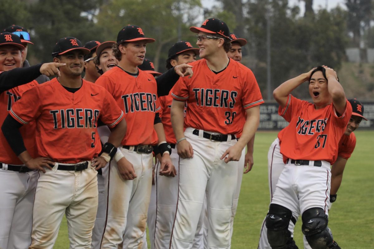 From left to right front row, Eddie Alfaro, 5, Bubba Heidler 1, Marc DiCarlo, 30, Riki Kubota, 37, Riverside City College players celebrate after winning the March 17 game against Golden West College at Evans Sport Complex. 