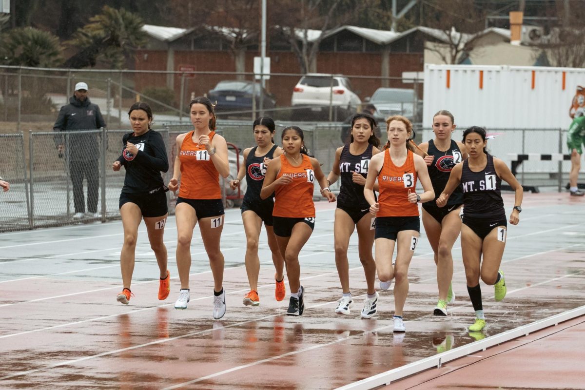 Leading the second heat of the women’s 1500-meter race, from the left Savanna Martin, Celeste Mendoza, and Jaiden Kelly, at Wheelock Stadium on March 14