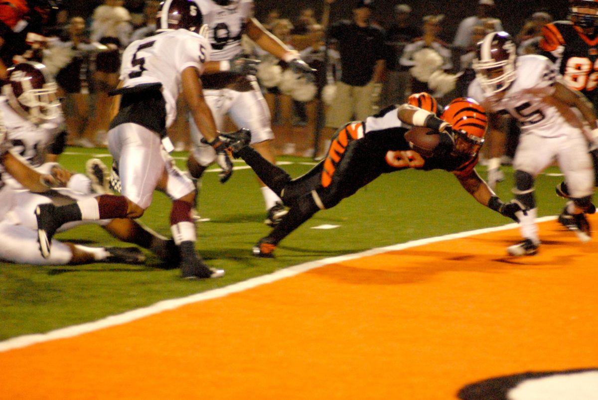 Tigers win 2013 football season opener