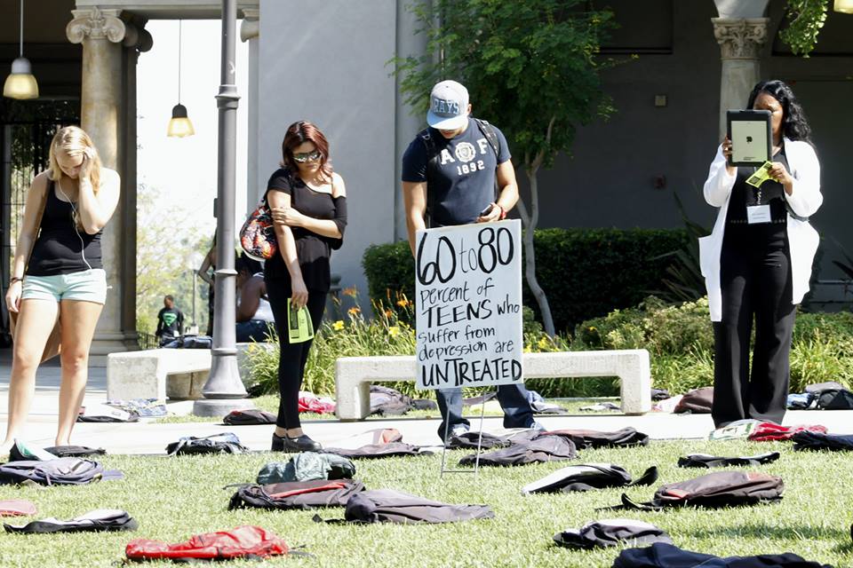 Inbetween classes Riverside City College students stopped to see what was on the 1,100 backpacks that laid in the middle of the RCC quad. (Luis Solis / Asst. Photo Editor)