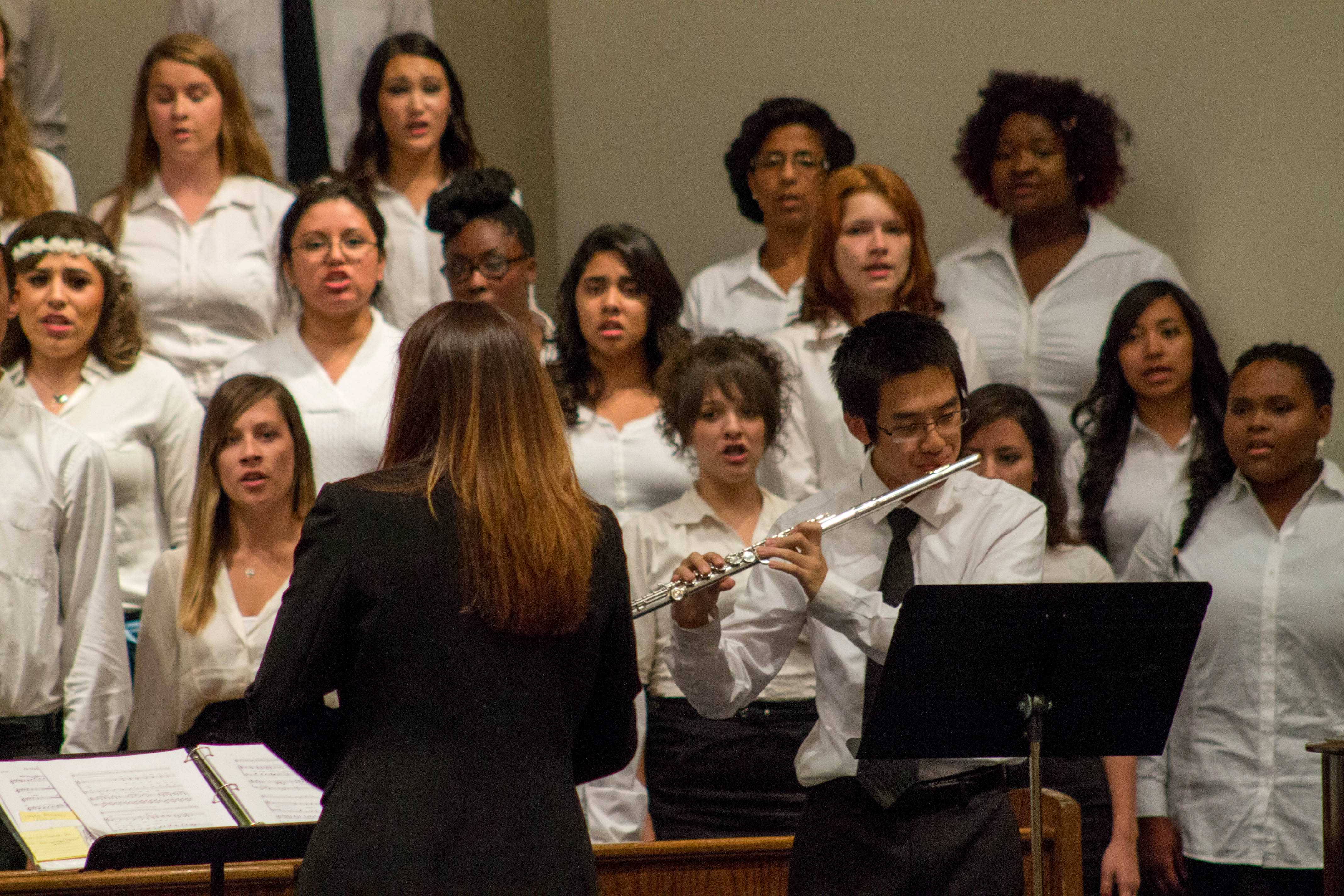 Harmony: RCC Choir performing "Light Born of Light" accompanied by Andrew Wang on the flute. Photo by Luis Solis | Staff Photographer