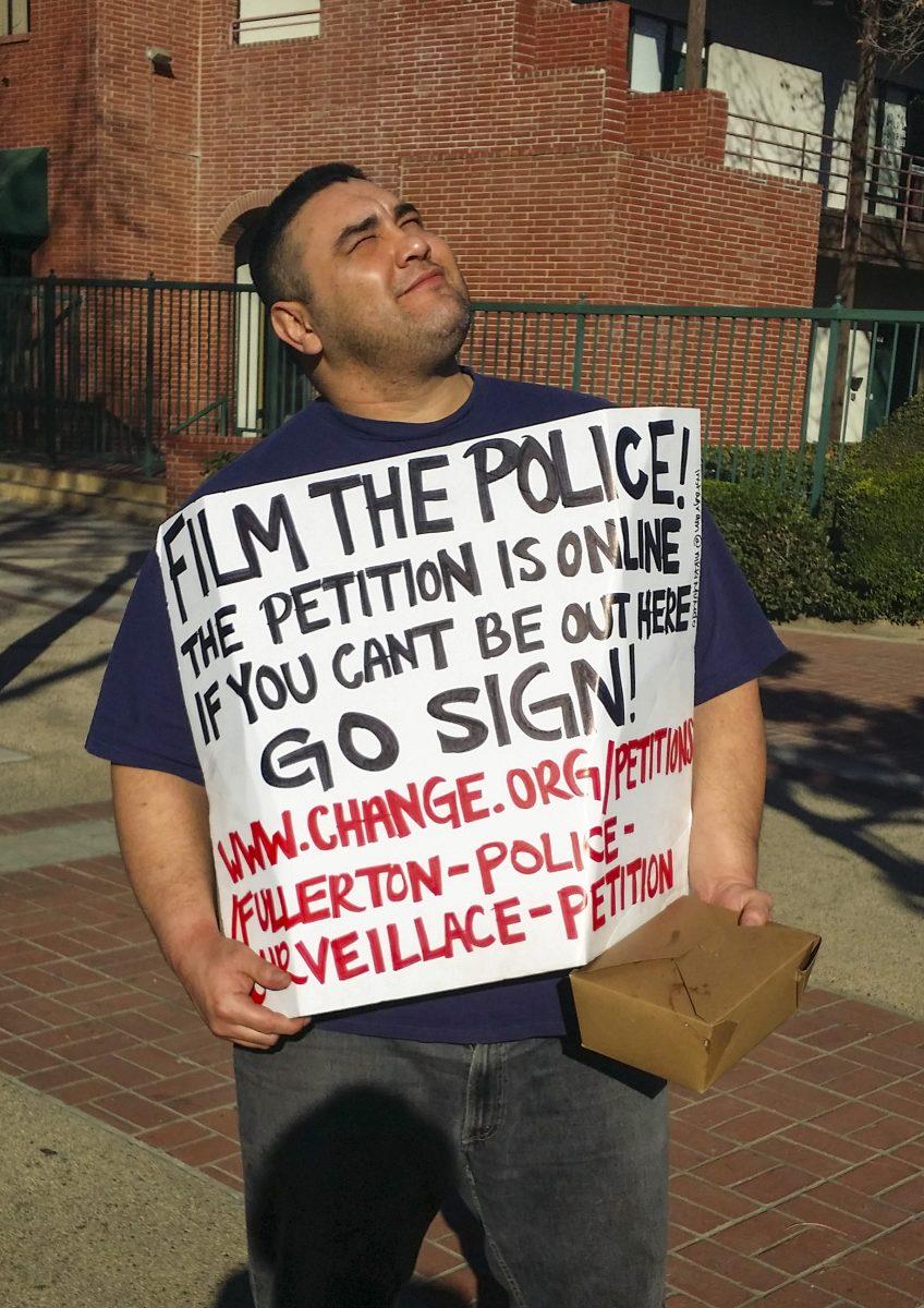 Protest: Edward Elisada, a bodyguard who knew Thomas, advocates for police surveillance. Photo by Josa Lamont