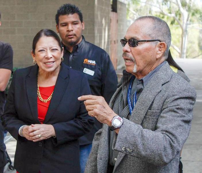 Former Interim Chancellor Dr. Cynthia Azari having a conversation near the ASRCC office with RCC Psychology Professor Clarence Romero. (Photo by Luis Solis)