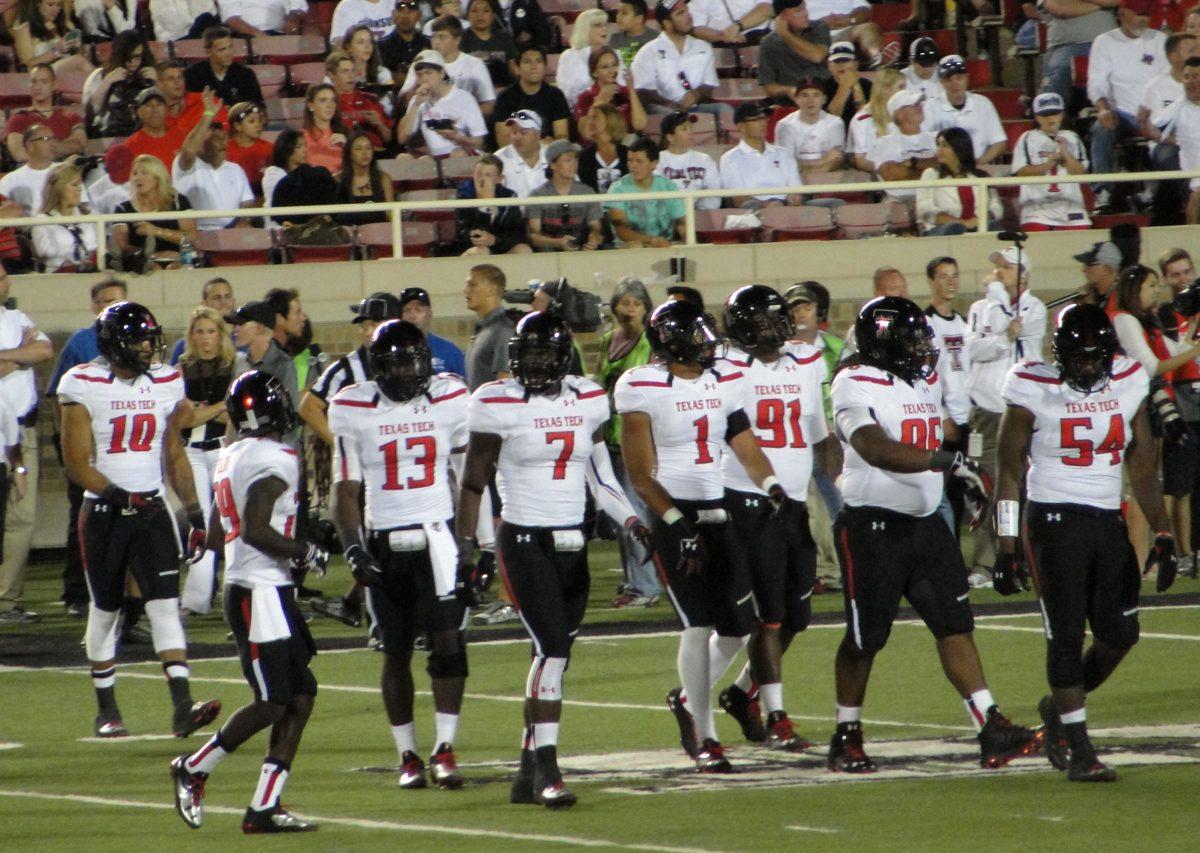 RED RAIDER: Former RCC linebacker Will Smith (7) walks onto the field with his Texas Tech defensive unit during his senior season. (Photo courtesy of Lesley Shelton)