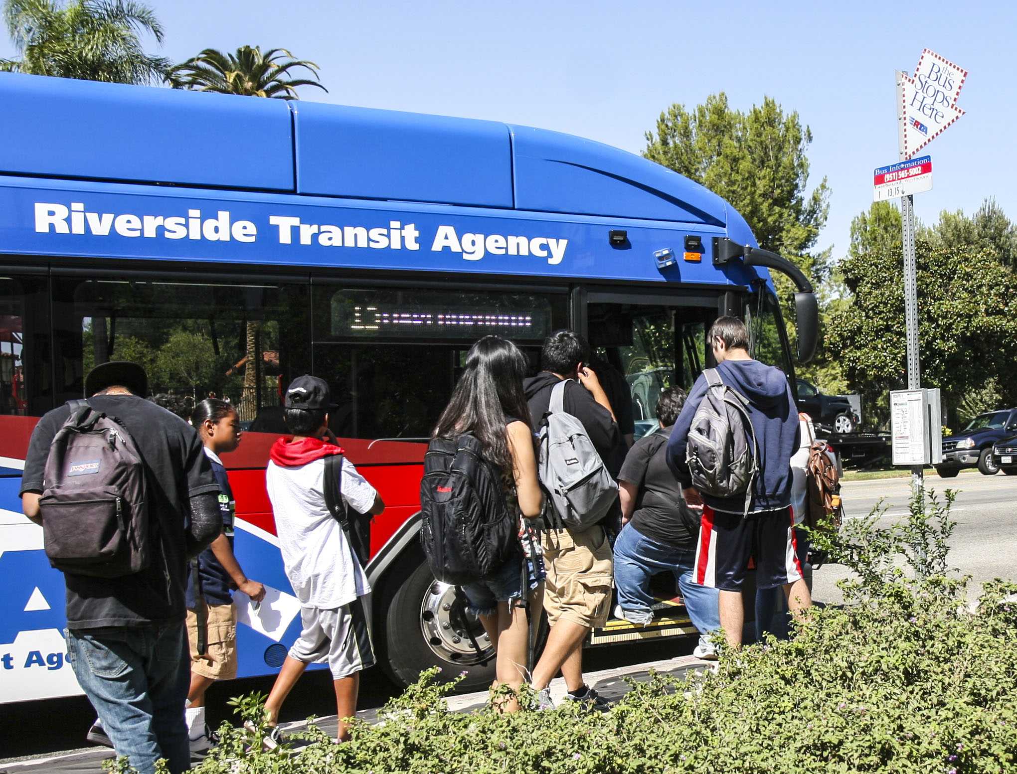 Students board Route 13 bus on Magnolia Ave.