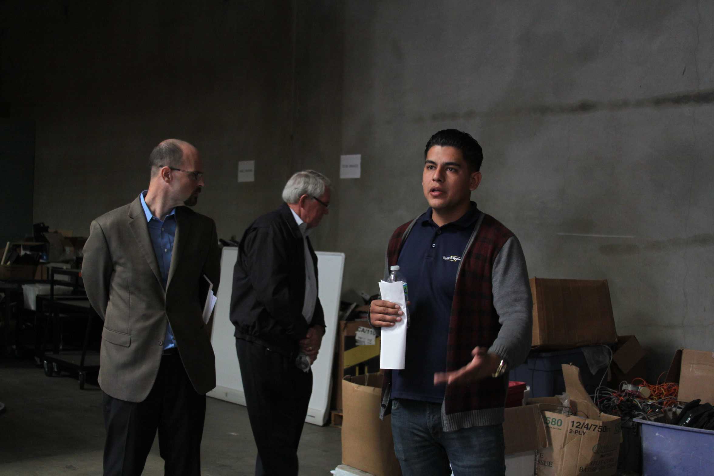 Jesse Guzman, Digital Inclusion program manager of SmartRiverside, leads a tour through their facility to display what employees and volunteers alike create in the everyday workspace on Nov. 20. The Bridge project upcycles used computers and provides them to low income families. 