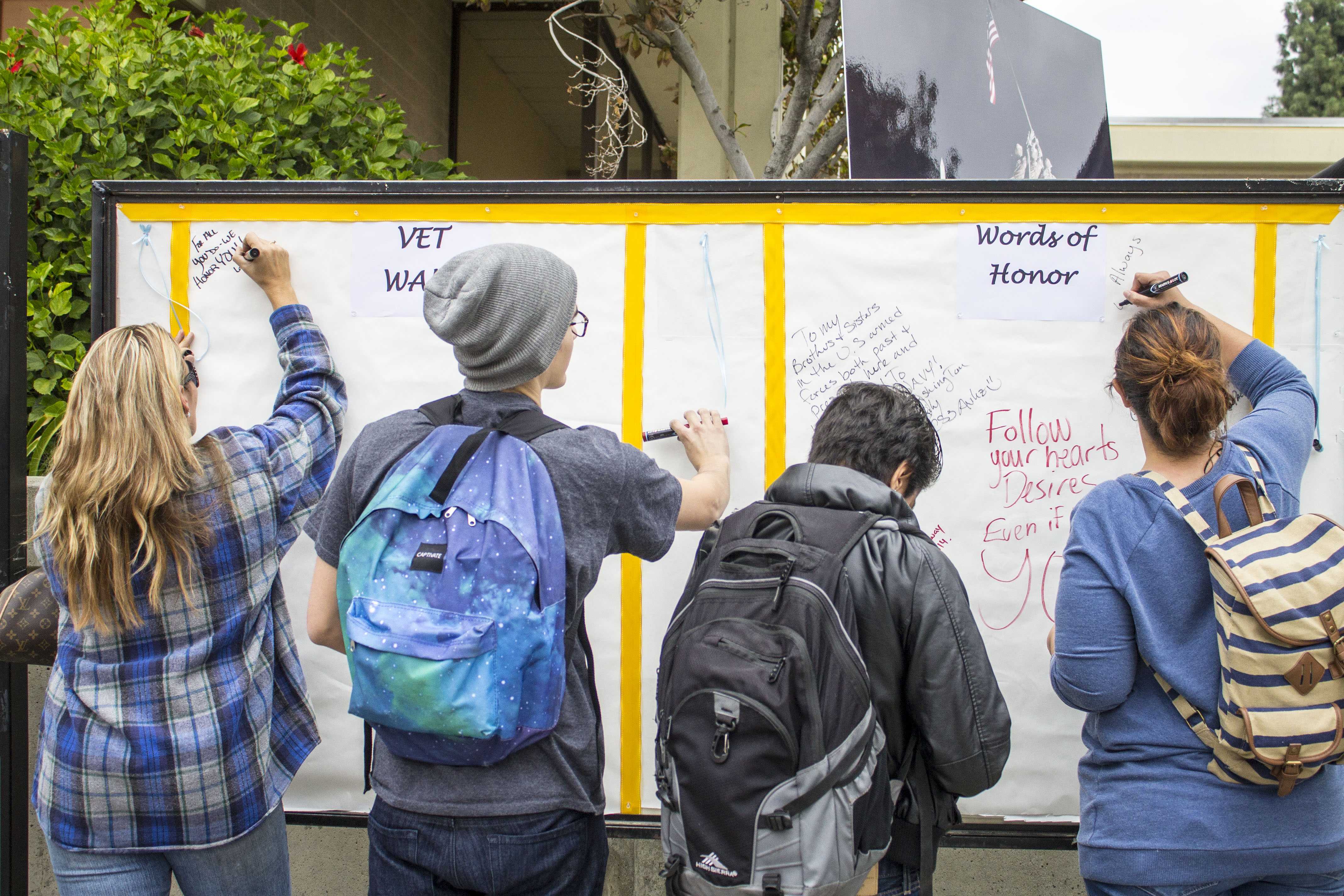 Luis Solis | Photo Editor Words on the wall: Students had the opportunity to write words of gratitude to veterans on a wall Nov. 11.