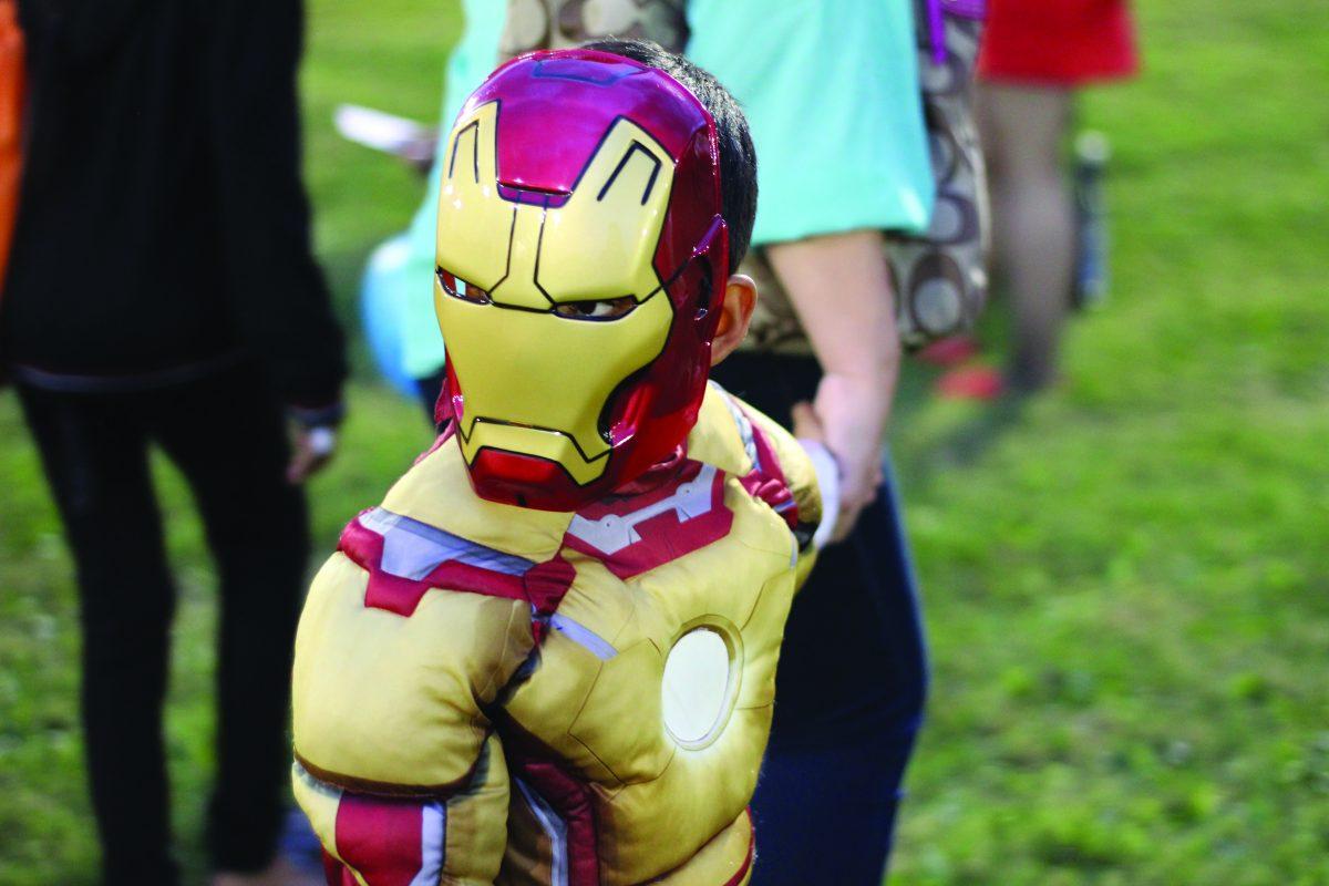 Carnival attendees dress in costumes to celebrate the Halloween Festivities