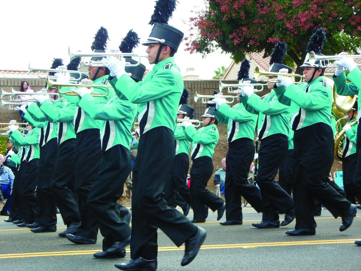 Santiago High School Marching Band and Color Guard perform "The Klaxon" on Cole Avenue in Riverside on Oct. 18. 