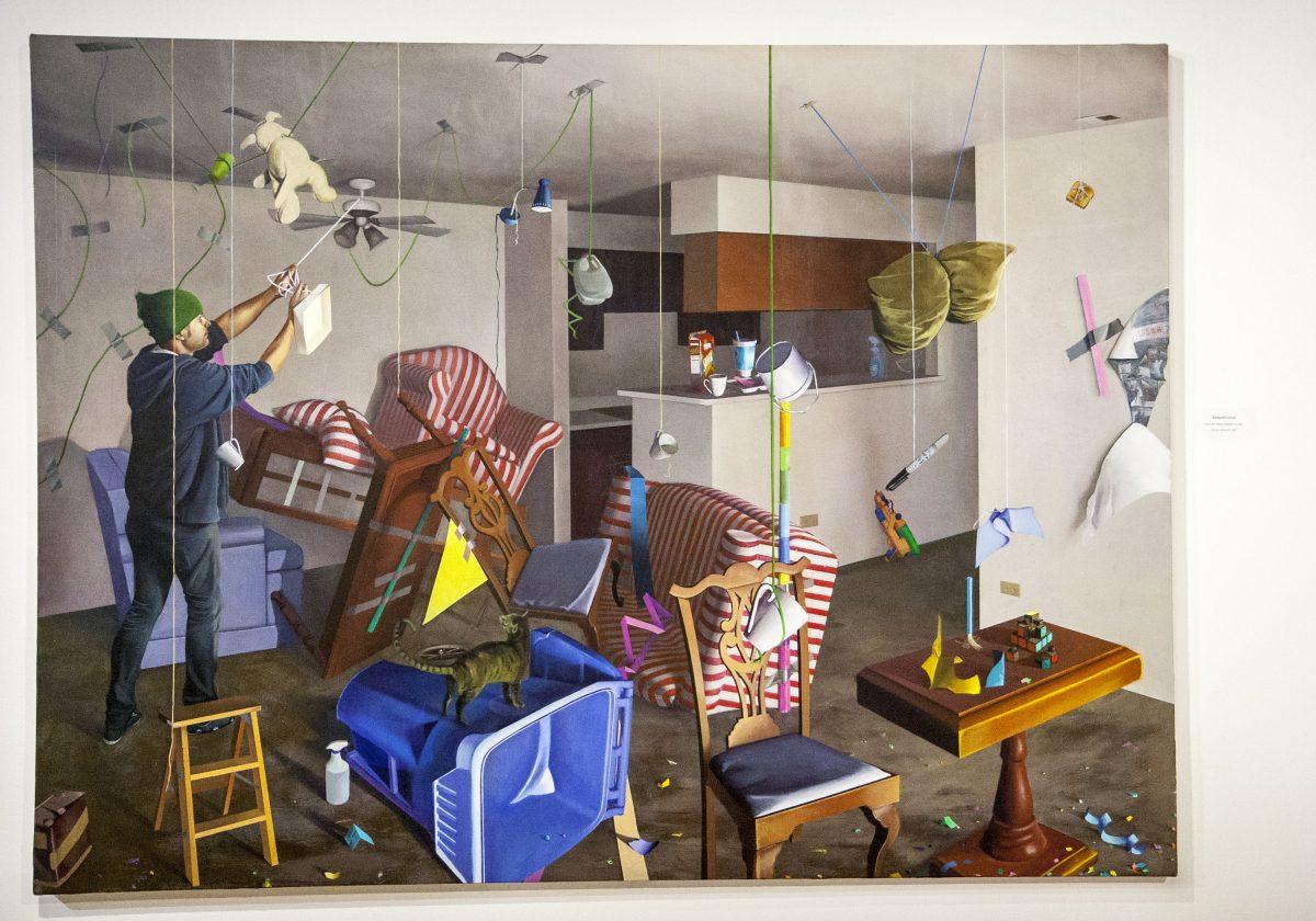  “Lost Art School Student in Apt.” by RCC alumnus Richard Corral is an expressive art piece that evokes images of “throwing it to the wall to see what sticks,” plays with identity and delves into string theory.
