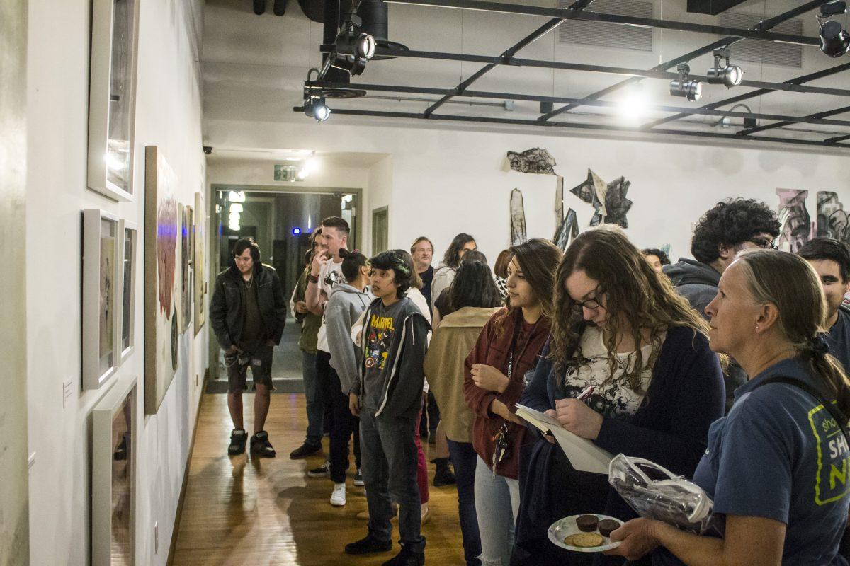 Frame Art: The Godfrey Daniels School of Charm art exhibit opens receptions March 5 at Riverside City College in the Quad Gallery. Attendees have many different arts to look
at from four different artists Claudia Bucher, Maryrose Crook, Georganne Deen and Jacobine van der Meer.       LUIS SOLIS / VIEWPOINTS