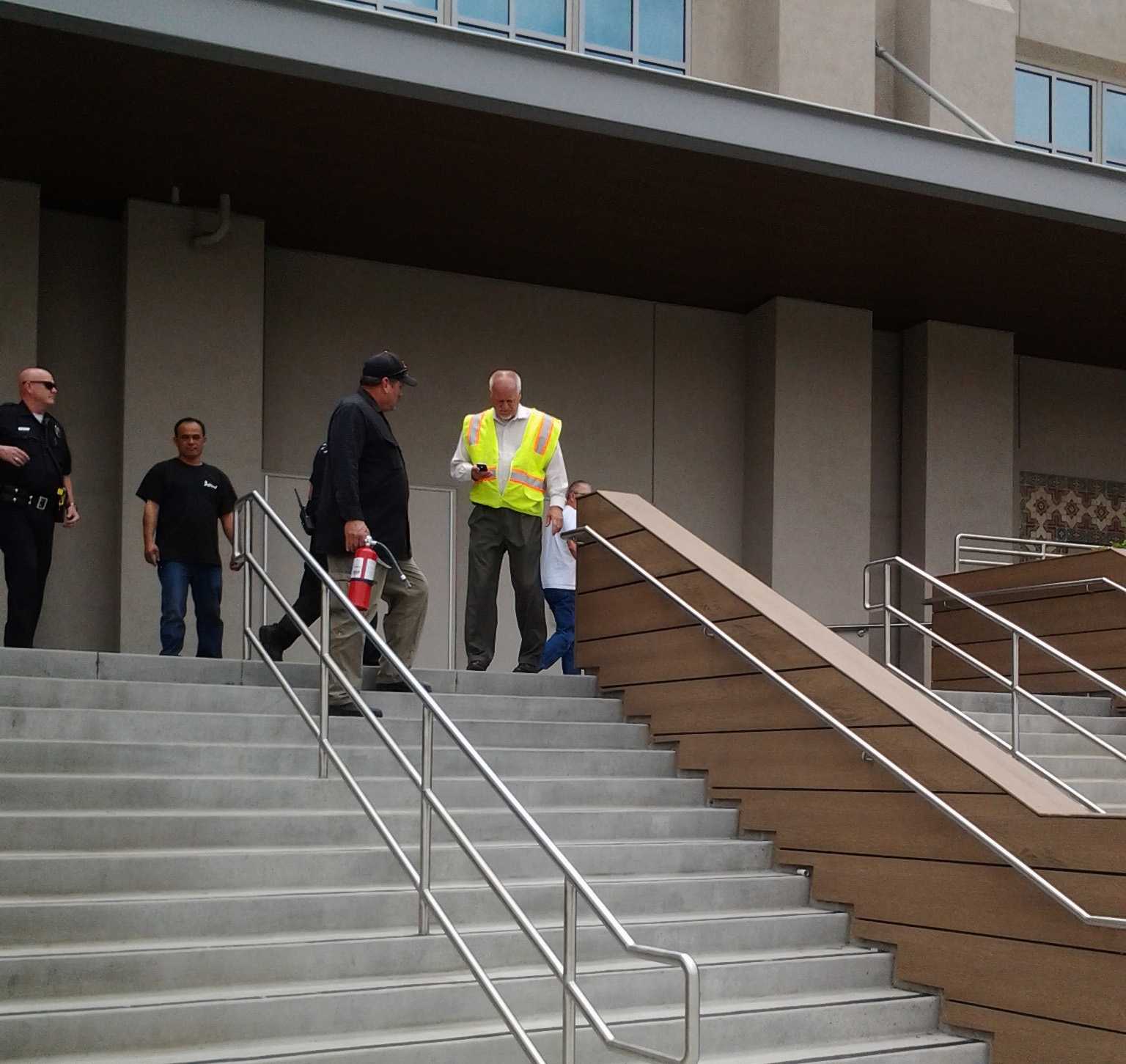 John Tack, general maintenance mechanic at RCC exits Wheelock Gym after extinguishing minor fire in the men's restroom on the northeast side of the building June 4.