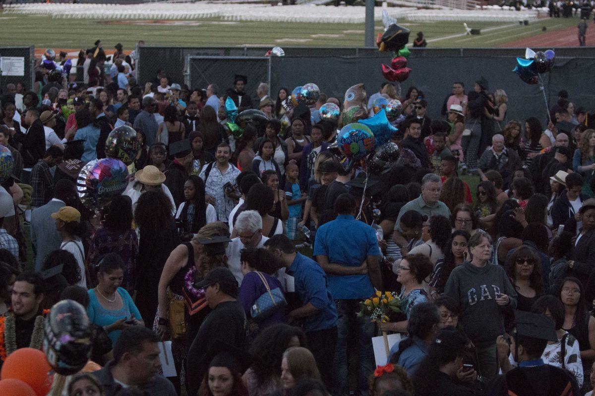 Friends and family members come together for pictures and gift-giving with graduates. Alexis Naucler | Viewpoints