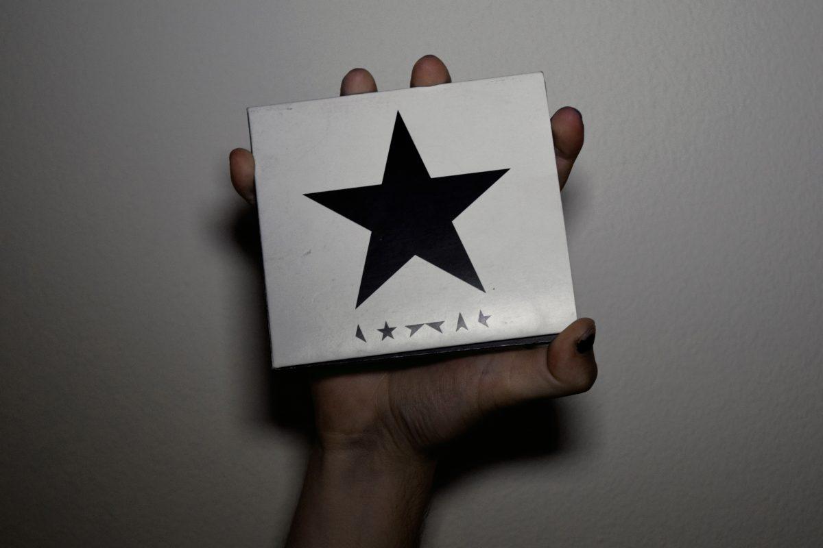 Writer Marcus Cocova holds up the album "Blackstar". (Photo: Zachariah Jolin)