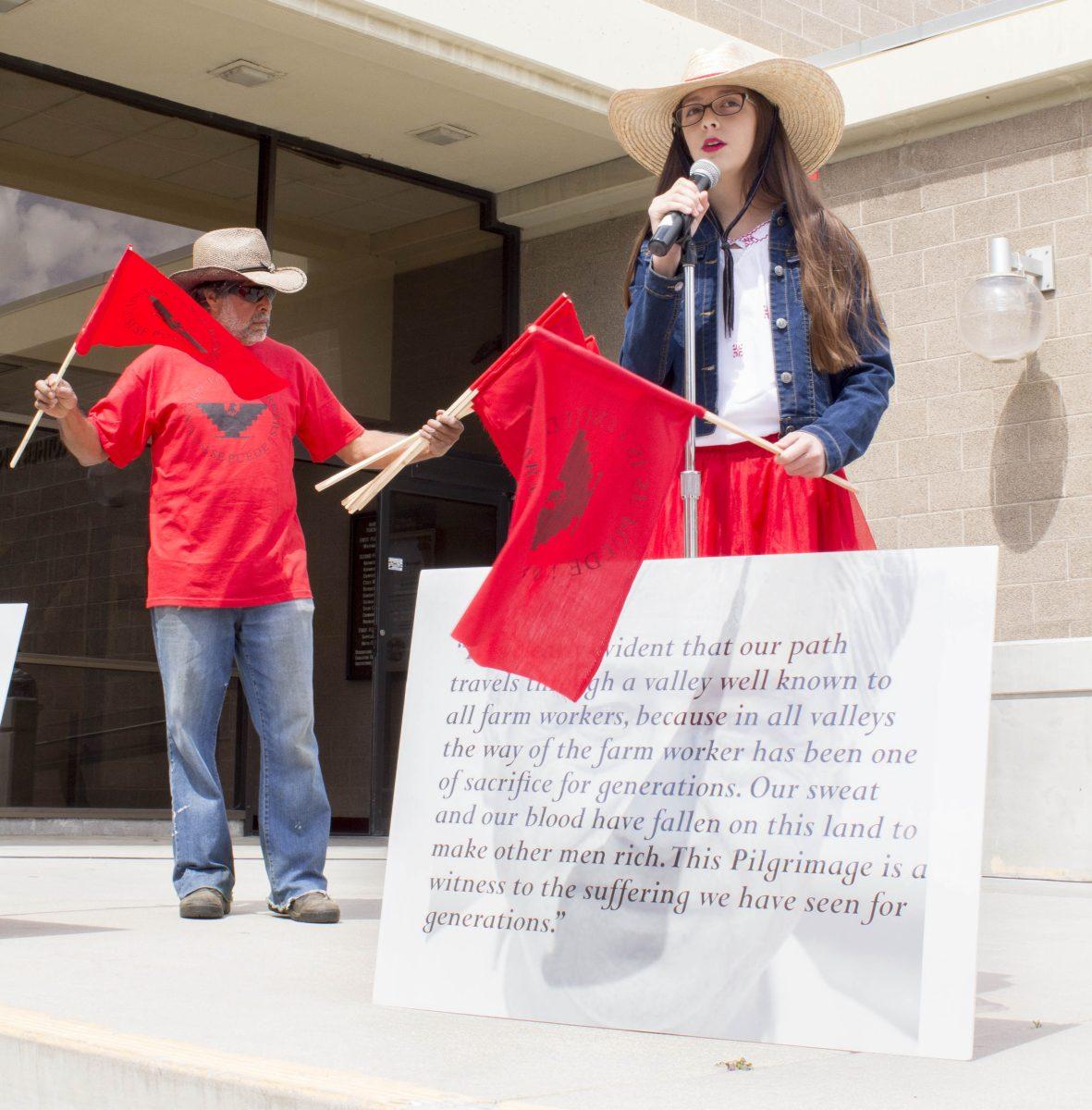 Riverside City College Groundsperson Miguel Arias and his granddaughter Julisa Veron celebrate the 31st anniversary of Cesar Chavez Day in front of the MLK steps on March 29.