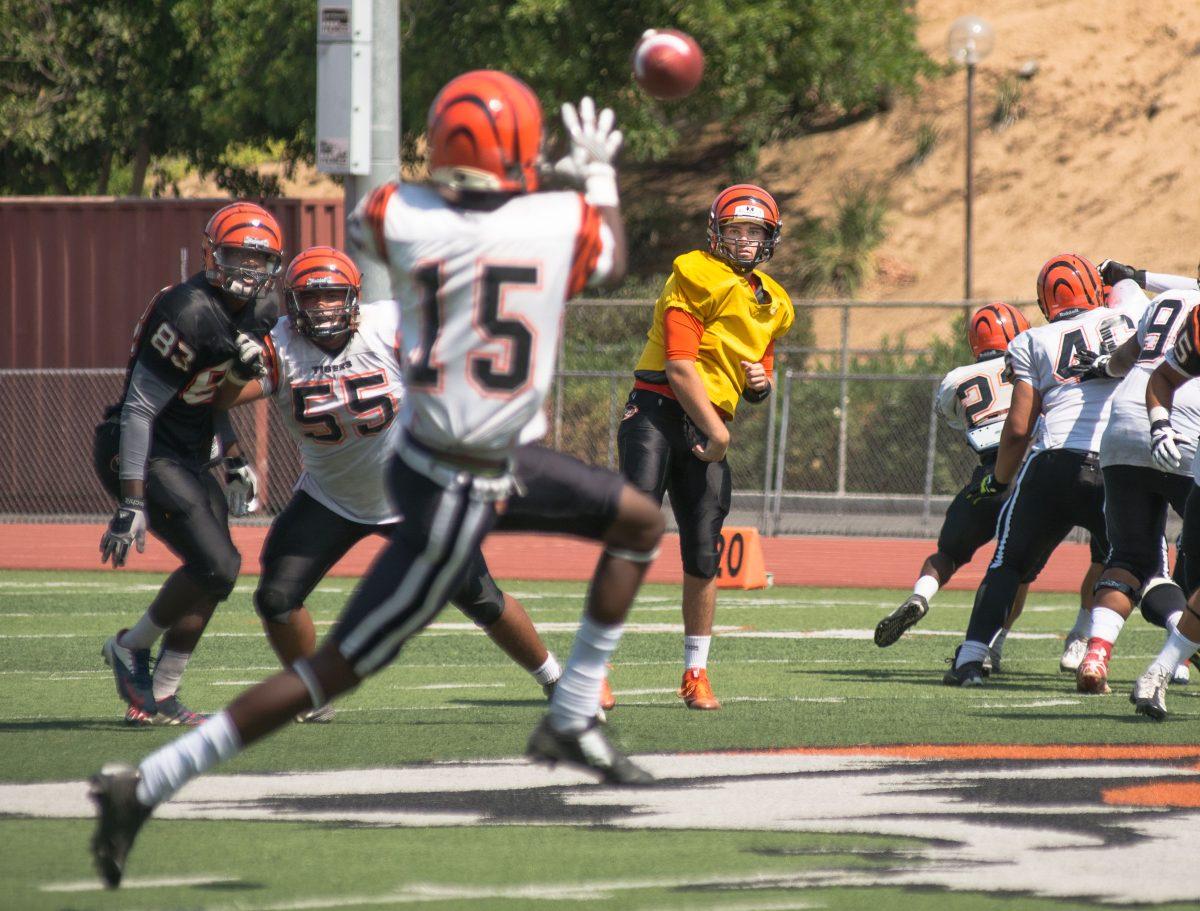 Stacy Soriano Viewpoints | Quarterback Ian Fieber finds wide receiver Jacoby Herring open for a pass during their scrimmage on Saturday, Aug. 20, 2016 held at the Arthur N.  Wheelock stadium.