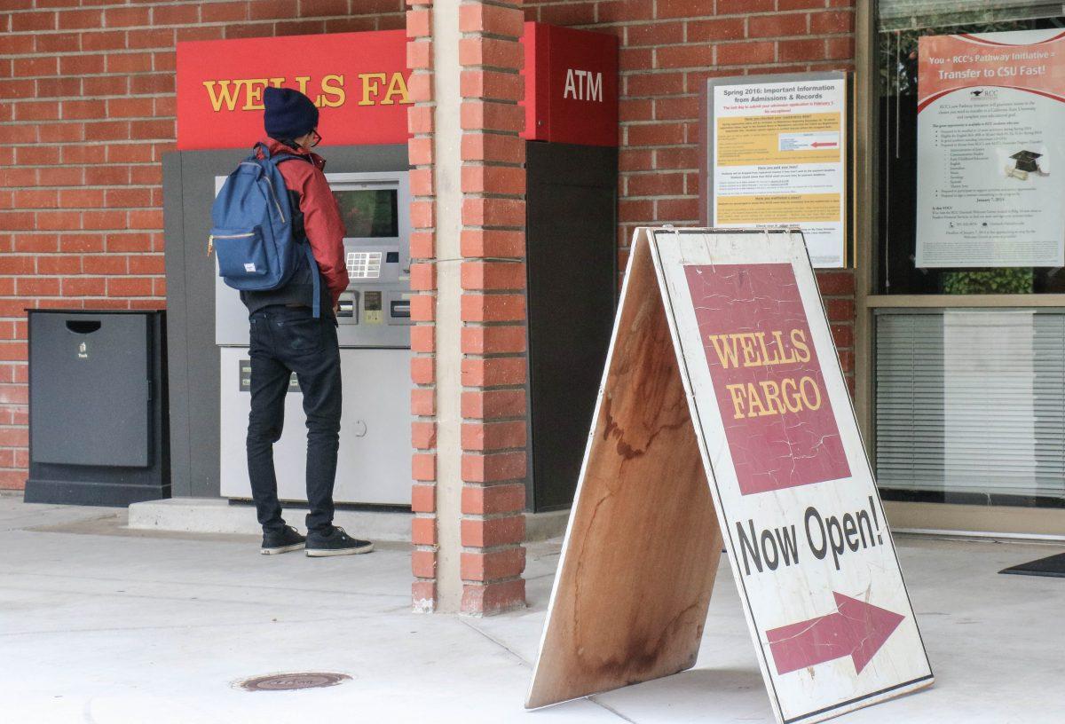 An RCC student withdraws cash at the Wells Fargo ATM machine outside the Cesar Chavez Building