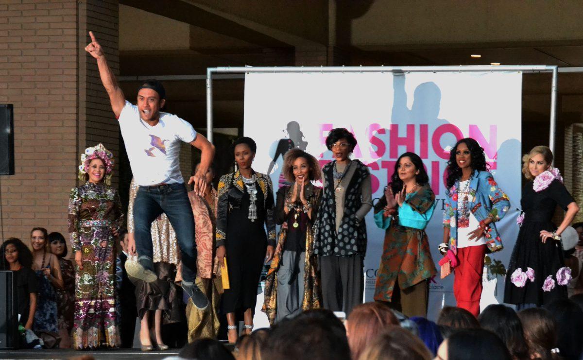 Family member of Breast Cancer survivor jumps for joy as he walks the runway at Fashion District downtown Riverside City Hall October 6, 2016 in clelebration of Breast Cancer Awareness