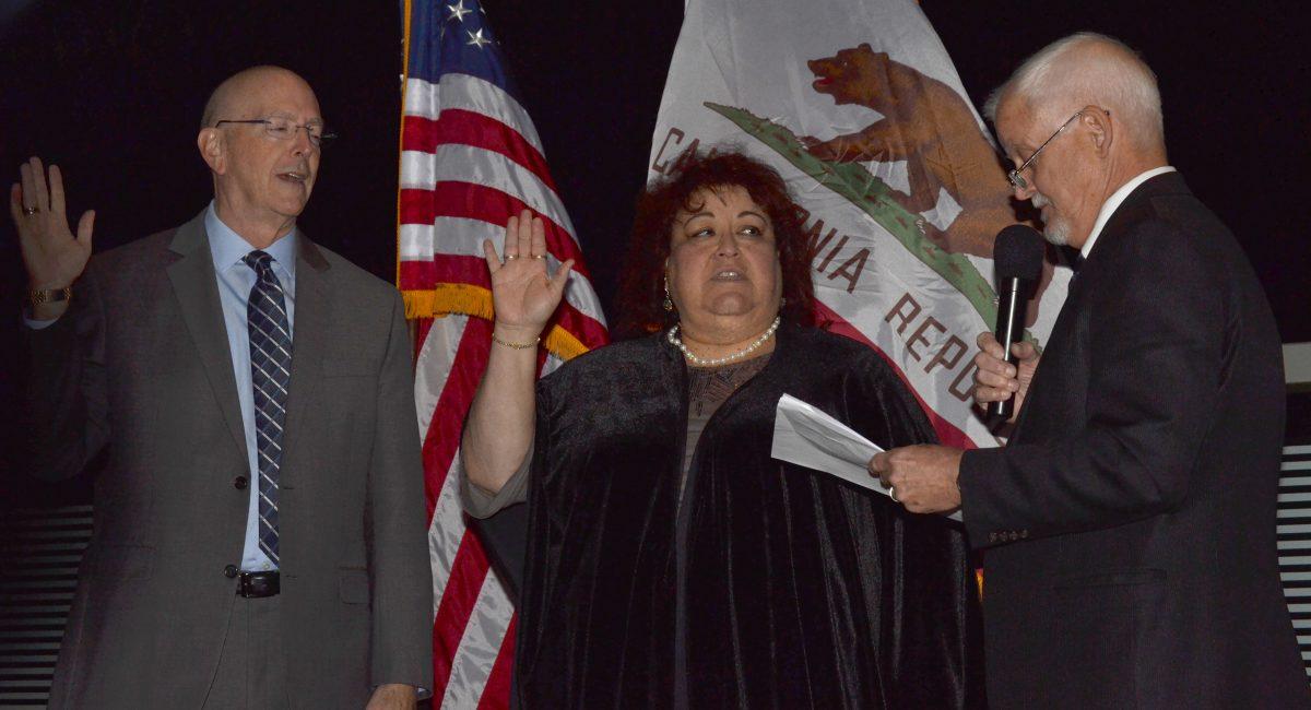 Newly elected board members being sworn in by Micheal L. Burke Chancellor during a ceremony at 3801 market street riverside, Ca 92501 on Nov 29, 2016 at 5:30 p.m