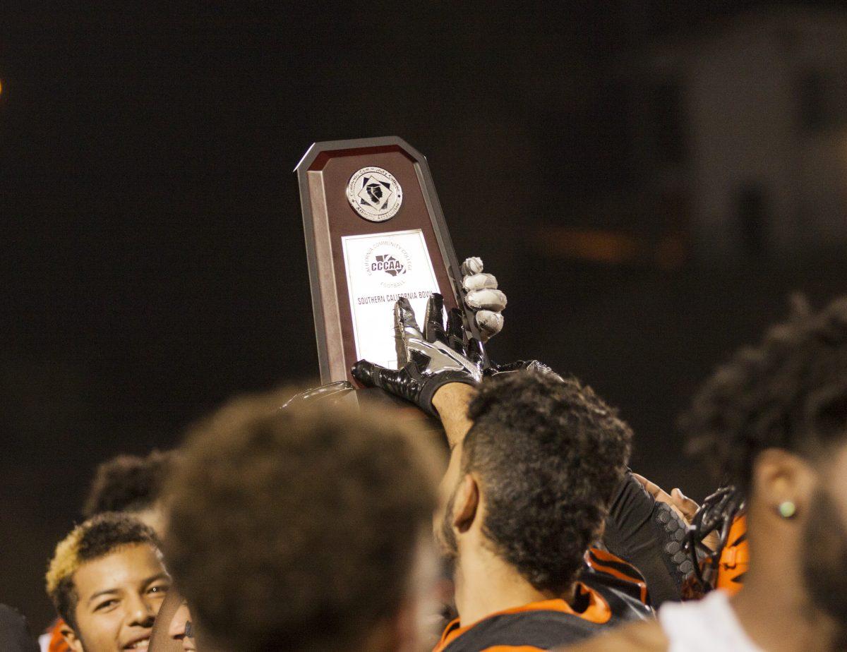 The Riverside City College football team holds the Southern California Bowl trophy in the air, after they defeated the Saddleback Gauchos 49-38 at Wheelock Stadium on Nov.19. (Daniel Francis| Viewpoints)