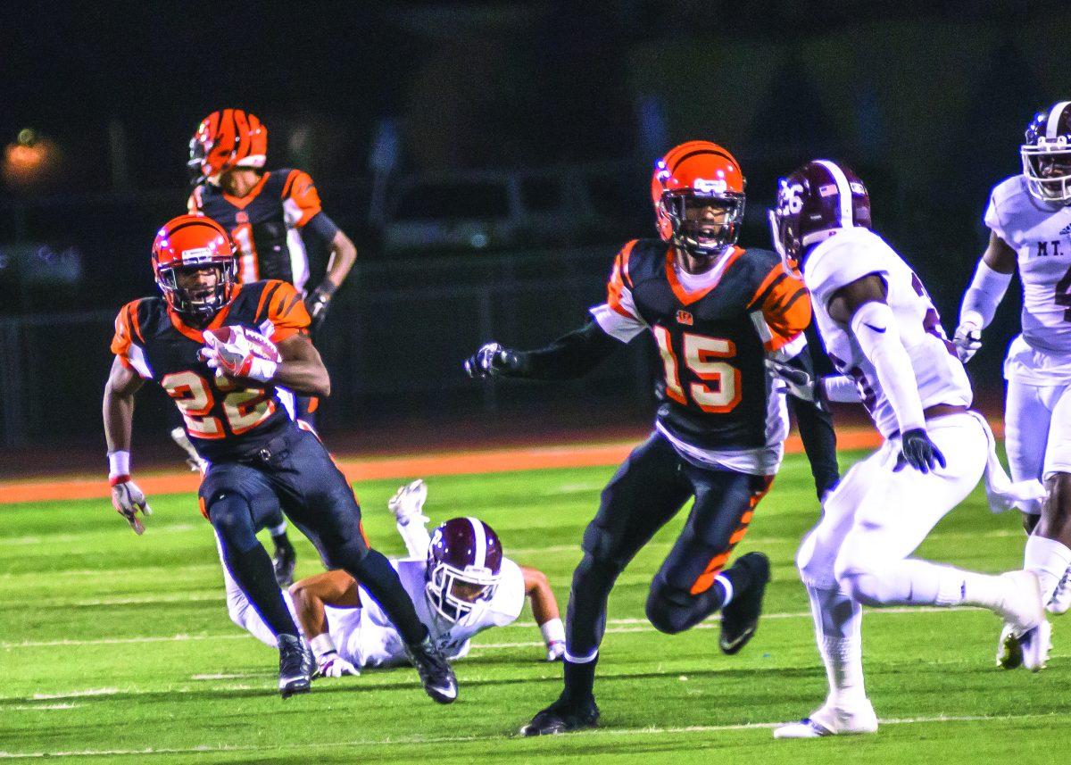 Running back Eltoro Allen misses a tackle while wide receiver Jacoby Herring blocks defensive back Reginald Young from Mt. Sac on Nov. 12. (Stacy Soriano| Viewpoints)