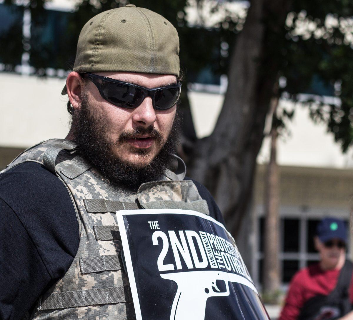 Stephen Reed, a Second Amendment advocate counter protesting in Downtown Riverside March 24.