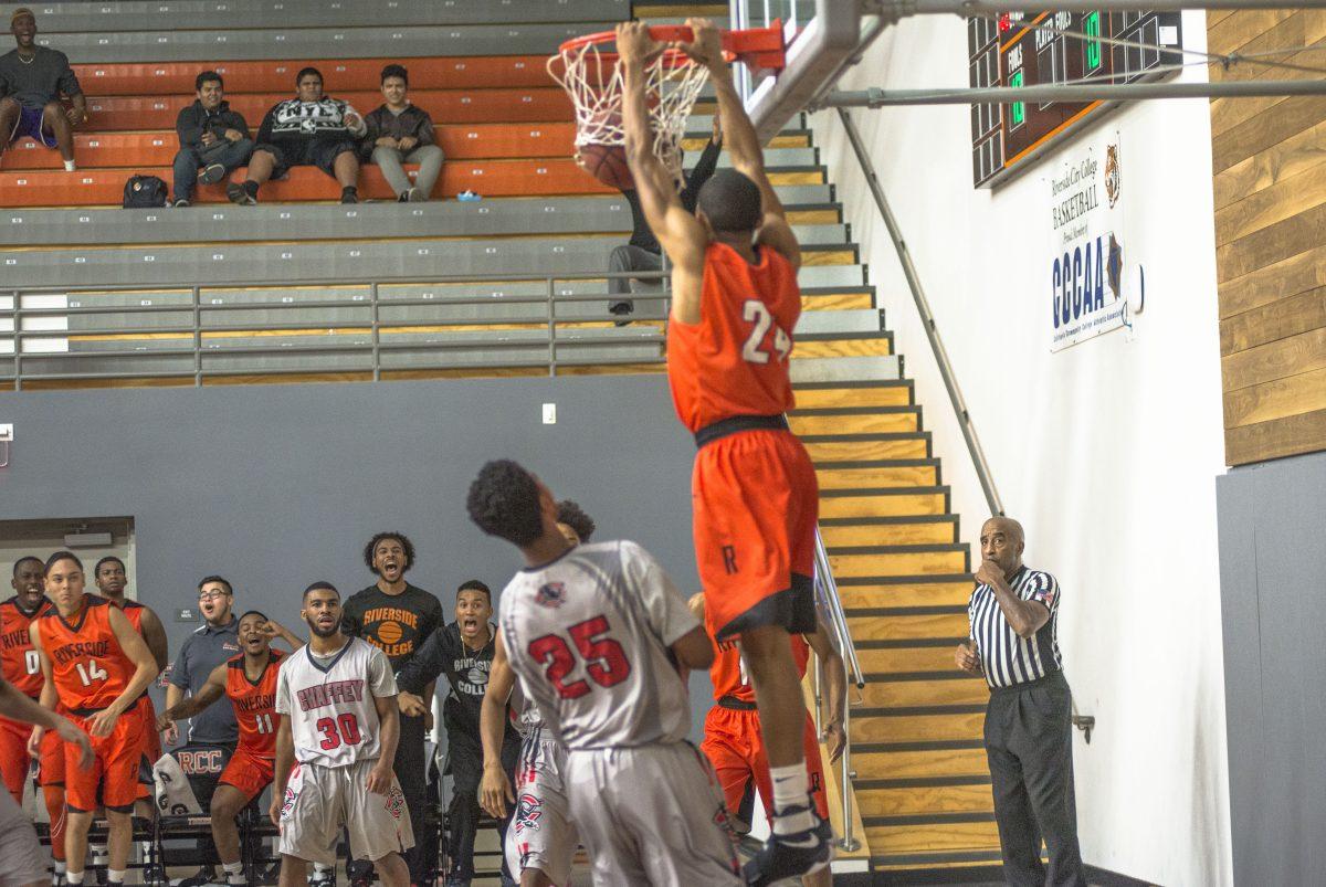 Small Guard for Riverside City College dunks the ball versus Chaffey College on Dec. 8, 2016 at RCC.