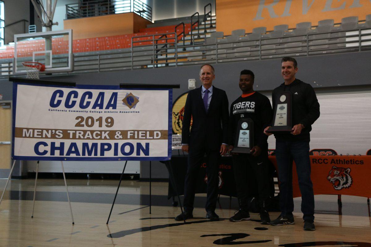 From left, Riverside City College President Gregory Anderson, womens head coach Damien Smith and head coach Jim McCarron celebrate the success of the the track and field teams during the state championship ring fitting ceremony in the Wheelock Gymnasium on May 21. The men won first place and the women took second. Mia Magaña | Viewpoints