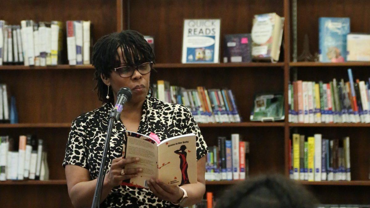 (Photo: Diego Lomeli | Viewpoints) Romaine Washington reads from her book "Sirens in Her Belly."