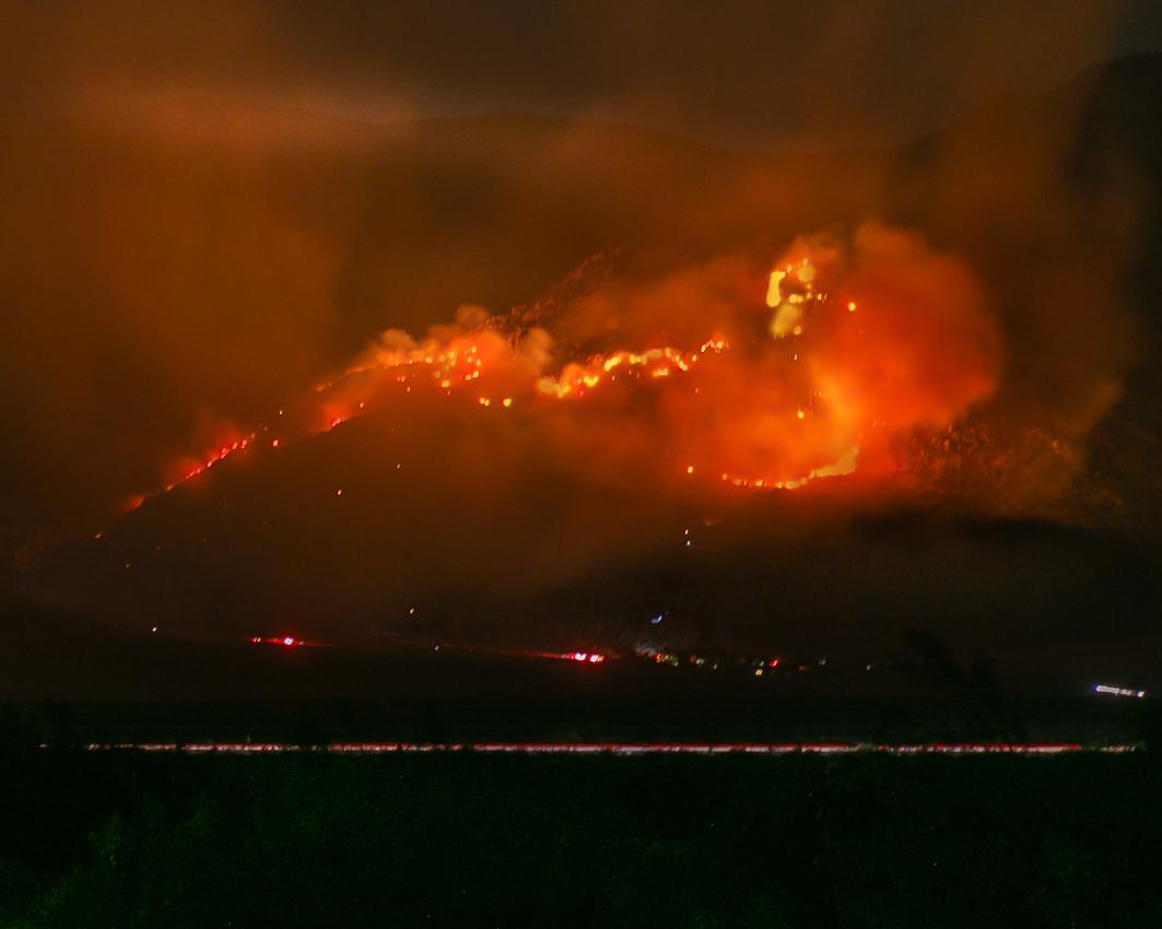 Fire crews work through the night Thursday to defend the small, unincorporated community of Snow Creek, northwest of Palm Springs, from the Snow Fire. The blaze is burning between Cabazon and Whitewater in the San Jacinto Wilderness and so far has destroyed 6,400 acres.  Photo by:  Joyce Nugent