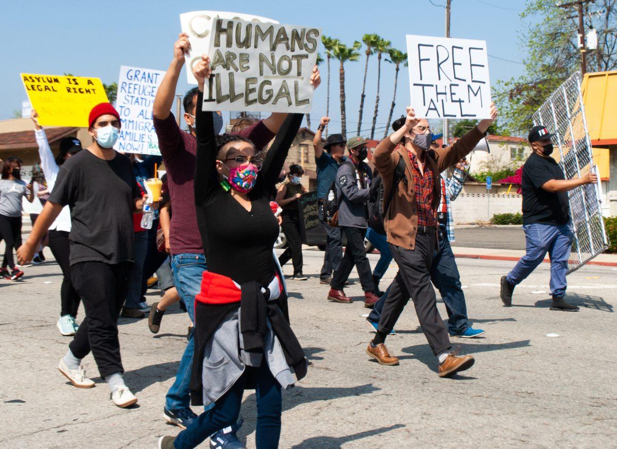 Protestors march down the streets of Pomona, protesting the detention of migrant children in the Pomona Fairplex. (Brian Calderon | Viewpoints)