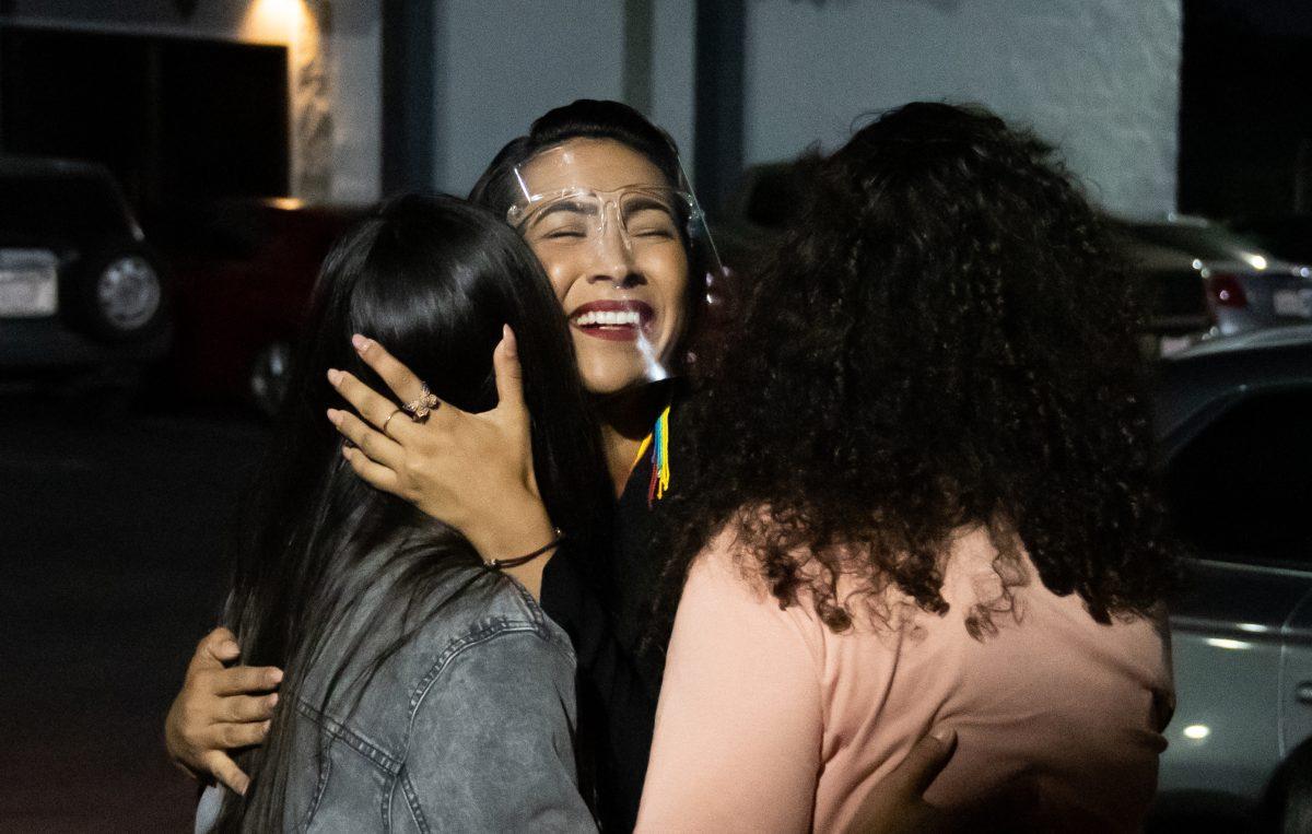 Ward 2 candidate Clarissa Cervantes embraces her sister, California State Assemblymember Sabrina Cervantes, and sister-in-law Courtney Downs in celebration of the initial Riverside City Council election results which show she is in the lead June 8. (Leo Cabral | Viewpoints)