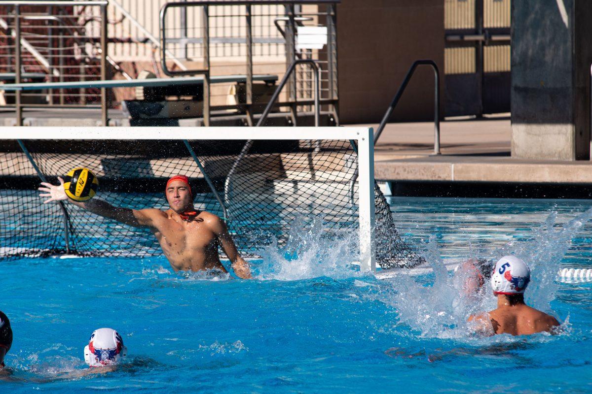 Seth Zarn (left, goalie) blocks a goal attempt from Jullian Nichols (5) on Oct. 15.