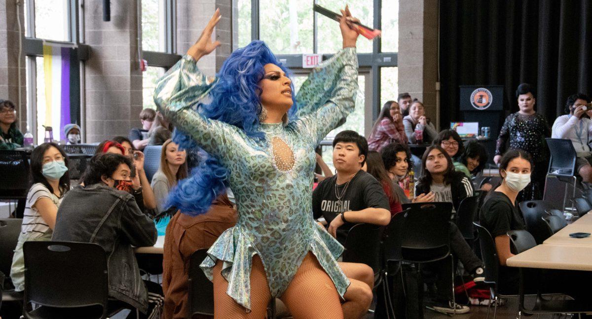 Drag performer Daisy Hollywood Williams lip syncs and dances through the Bradshaw Building cafeteria seating area for the SAGA drag show Nov. 18. (Leo Cabral | Viewpoints)