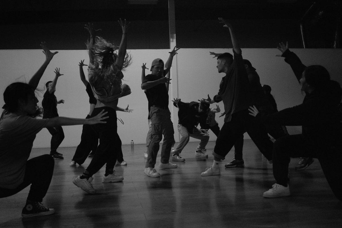 Seji Gaerlan (middle) practices his section of the dance routine alongside the members of the Syde Project as they prepare for a dance competition. (Daniel Hernandez | Viewpoints)