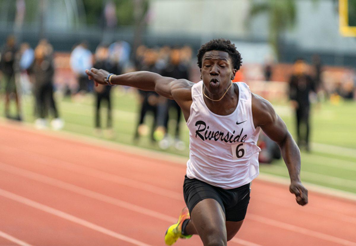 Riverside City College Tiger Lovewyn Don-Willies, 6, crosses the finish line and took 5th place with a time of 11.03 seconds running the men's 100-meter March 4 at the RCC Invitational Track and Field Meet. (Stephen Day | Viewpoints)