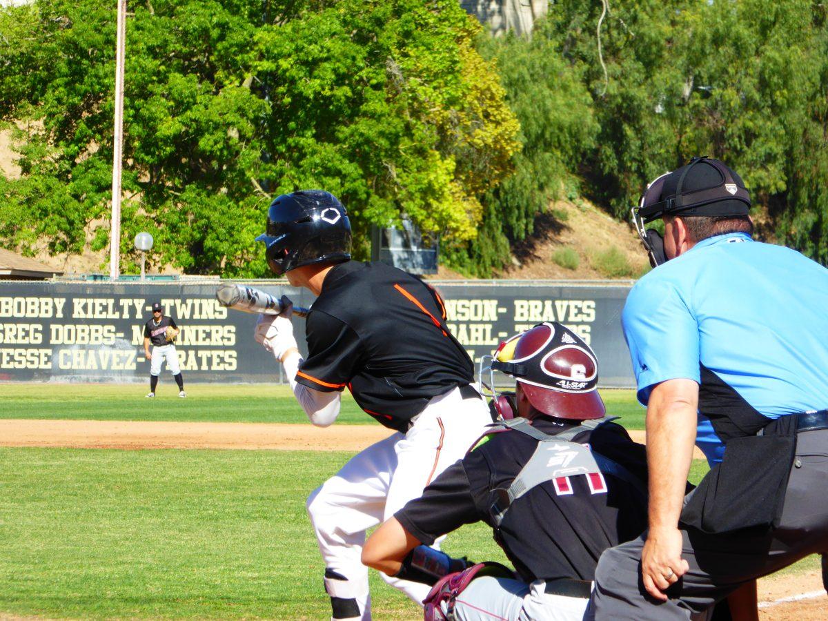 Julian Alvarez attempts to advance the players March 8.