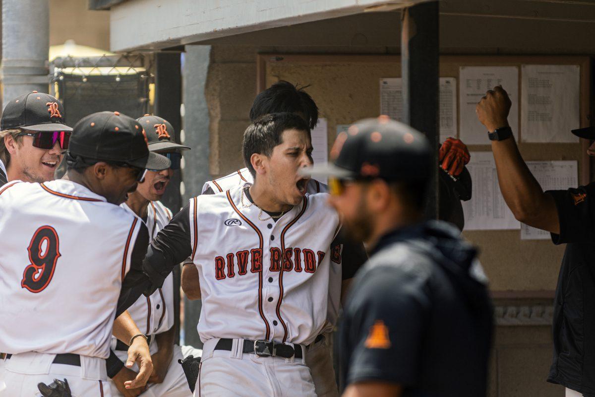 Riverside City College Tiger, Daniel Garcia, 11, celebrates back at the dugout after nailing a two-run homerun in the first inning.

Tigers beat the Cypress Chargers 10-5 in game 3 of the rubber match of the California Community College Athletic Association (CCCAA) Southern Regional round two. Tigers look to advance to the state championships for the first time since 2008.
(Stephen Day |Viewpoints)