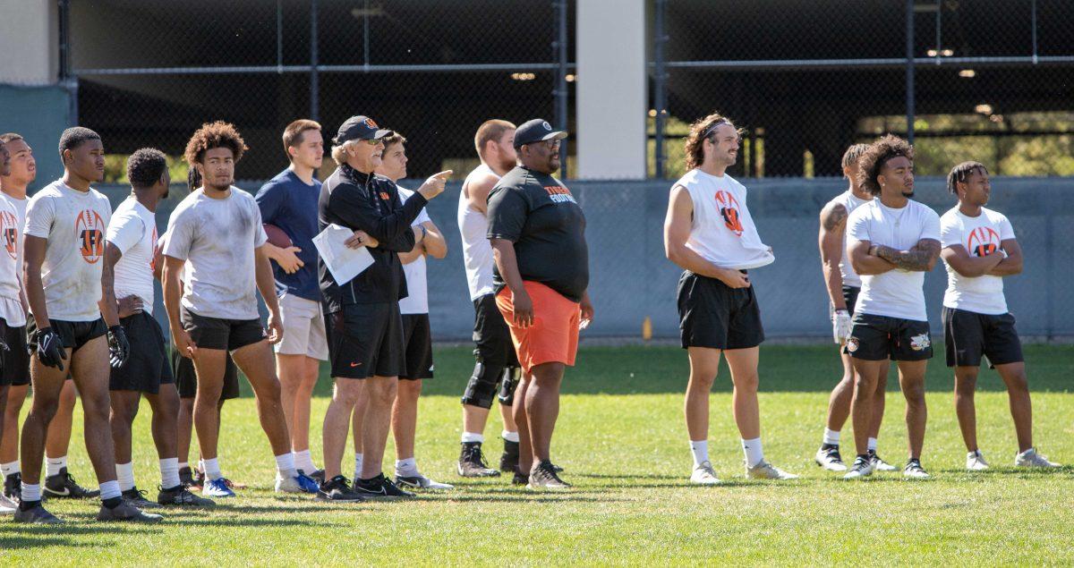 RCC coaches and players take a breather on the sideline as other players practice for the upcoming season, April 21. Daniel Hernandez Viewpoints