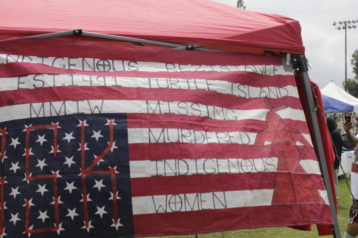 An upside down American flag claims Indigenous resistance since 1491, when Europeans first made contact with what is now known as the United States, at the University of California, Riverside Native American Student Program's Annual Pow Wow held May 27-29
