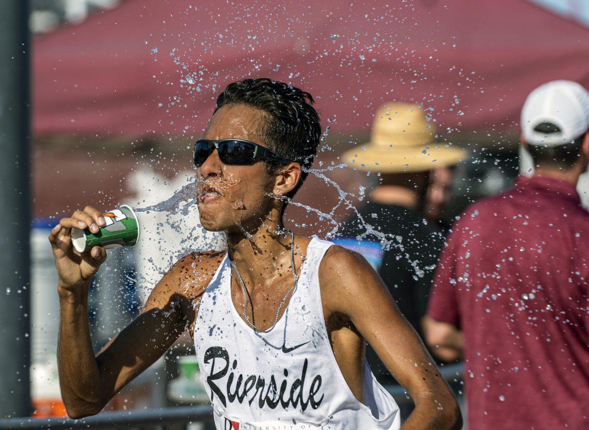 Water splashes on the face of Riverside City College Tiger David Rush to help cool him down during the Redlands Invitational where temps exceeded 100 degrees on Sept 3 at Redlands University.

Photo By Stephen Day, Viewpoints