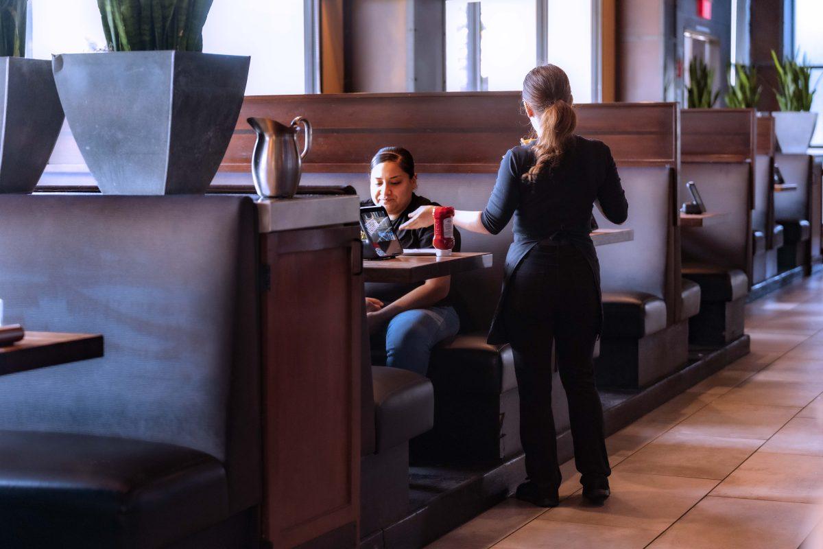 A server at Yardhouse manages their customers on a slow happy hour Tuesday afternoon.

Photo by Stephen Day, Viewpoints.