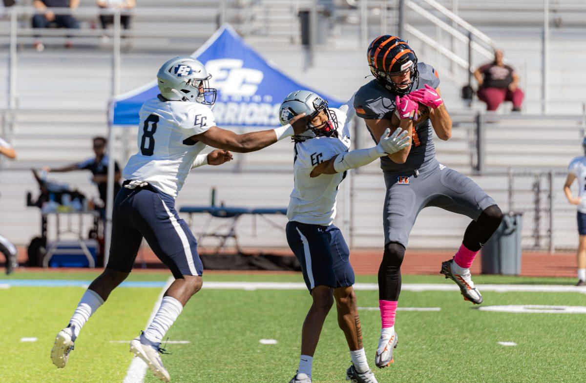 Reggie Retzlaff completes the reception despite double coverage from the Warriors on Oct 29 at Ramona HIgh School.

The Tigers continued their undefeated streak by defeating the El Camino Warriors 45-10.