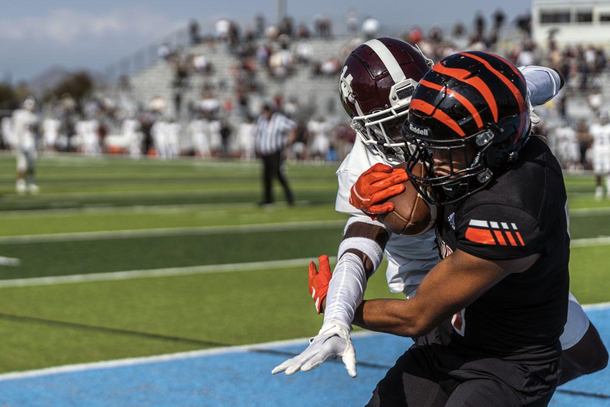 Despite extremely close coverage, Roshawn Lacy catches the pass.

Photo by Stephen Day, Viewpoints.