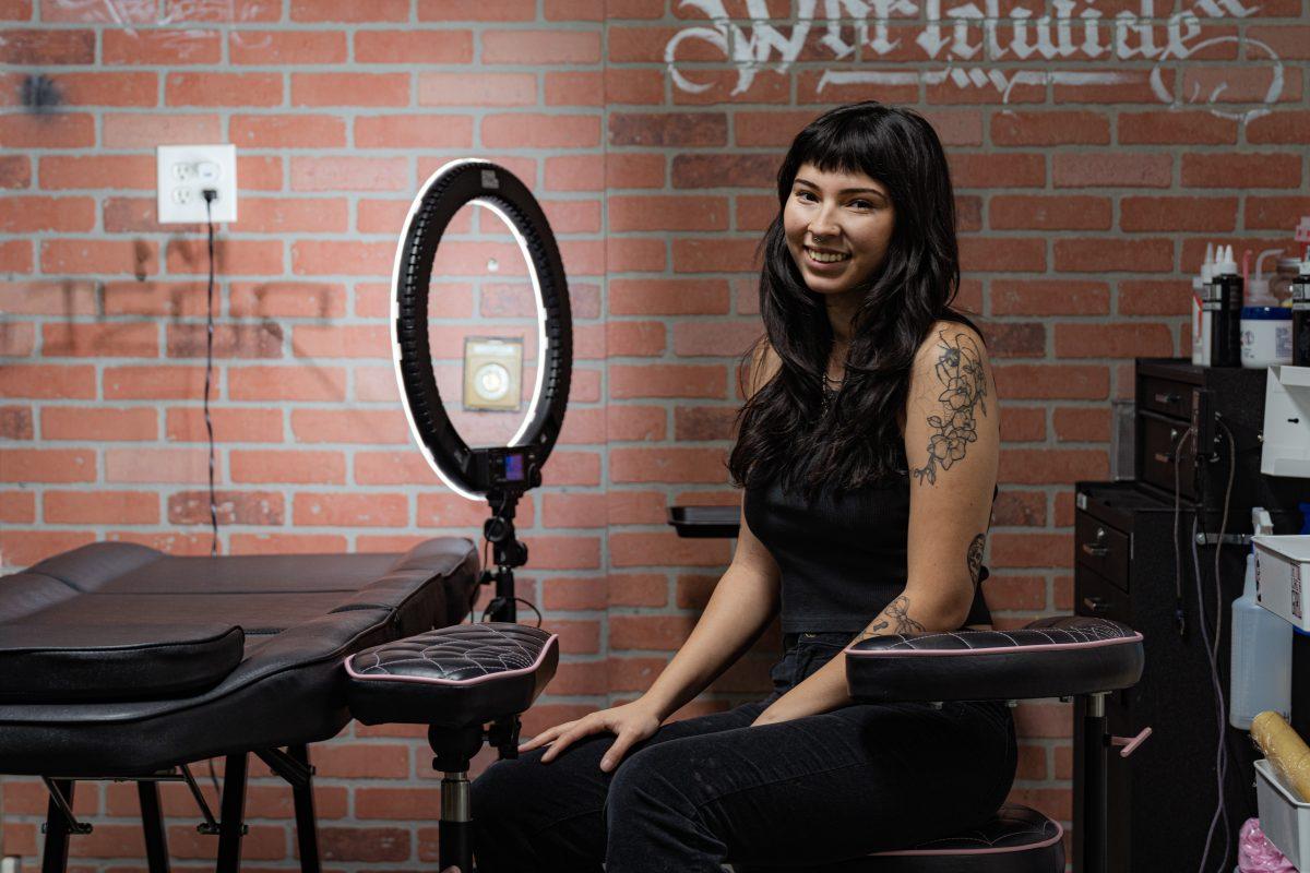 Valerie Suarez, resident tattoo artist at Truest Tattoo, sits at her table on Nov 3.  (Stephen Day, Viewpoints)