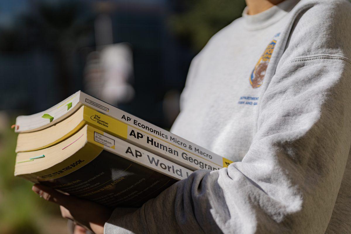 A student carries their various Advanced Placement (AP) textbooks on Nov 9.  AP classes give students an head start on college level classes they'll have after high school.

Photo by Stephen Day, Viewpoints