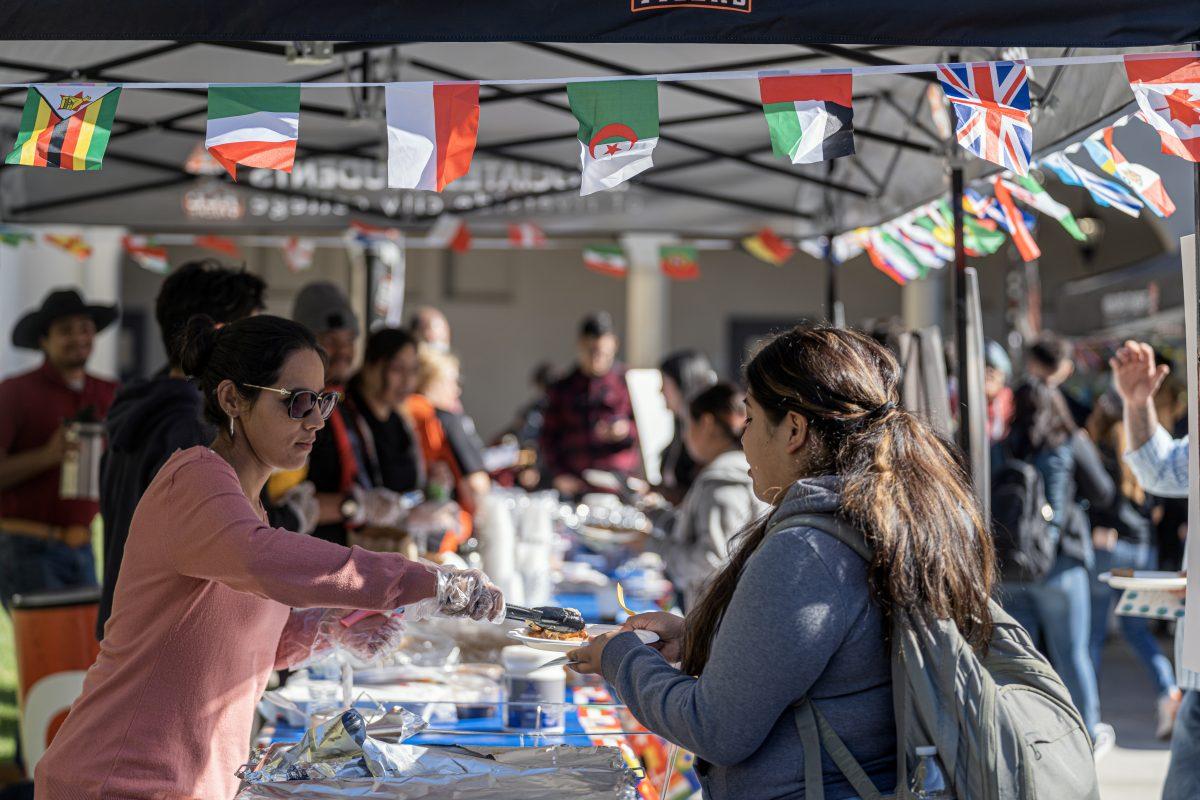 Faculty and ASRCC clubs serve authentic foods from a variety of countries to students who attended the Taste of Nations in the Quad courtyard on Nov 15. 