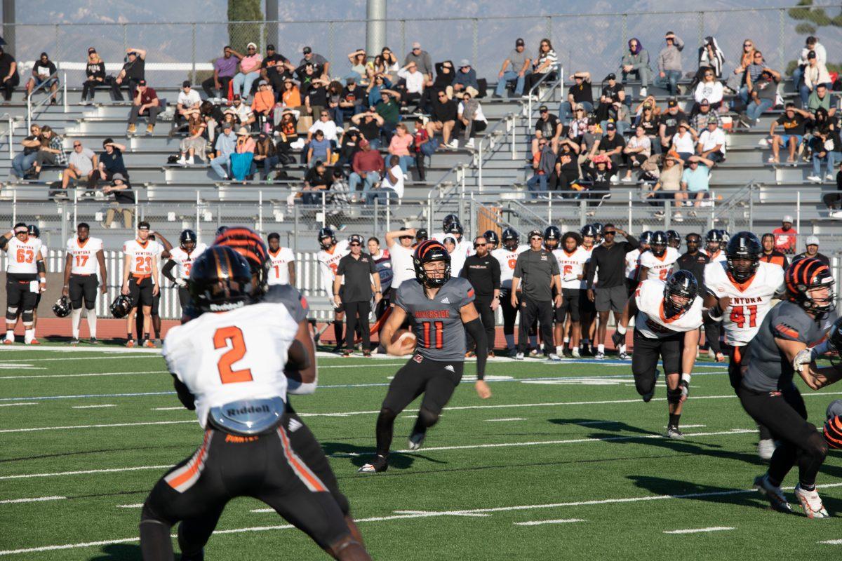 Quarterback Jake Retzlaff scrambles through a gap at San Bernardino Valley College on Nov. 26.