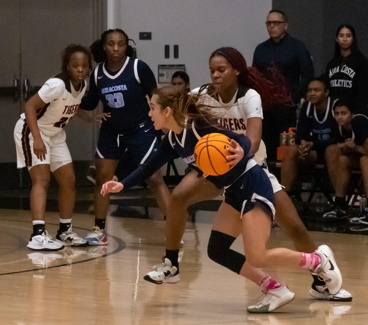 Freshman forward Janara Williams defends a Spartan. The Tigers totaled 17 turnovers on Feb. 22 at Wheelock Gymnasium. Photo by Matthew Acosta, Viewpoints.