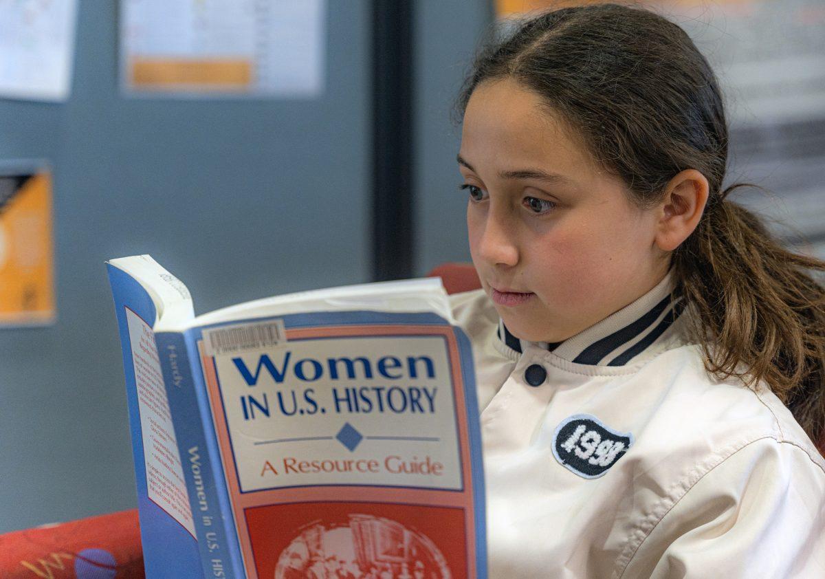 A young student reads about Women in U.S. history at the local college library on Mar 8.  Influencial women in history are often overlooked in standard educational programs.

Photo by Stephen Day, Viewpoints.